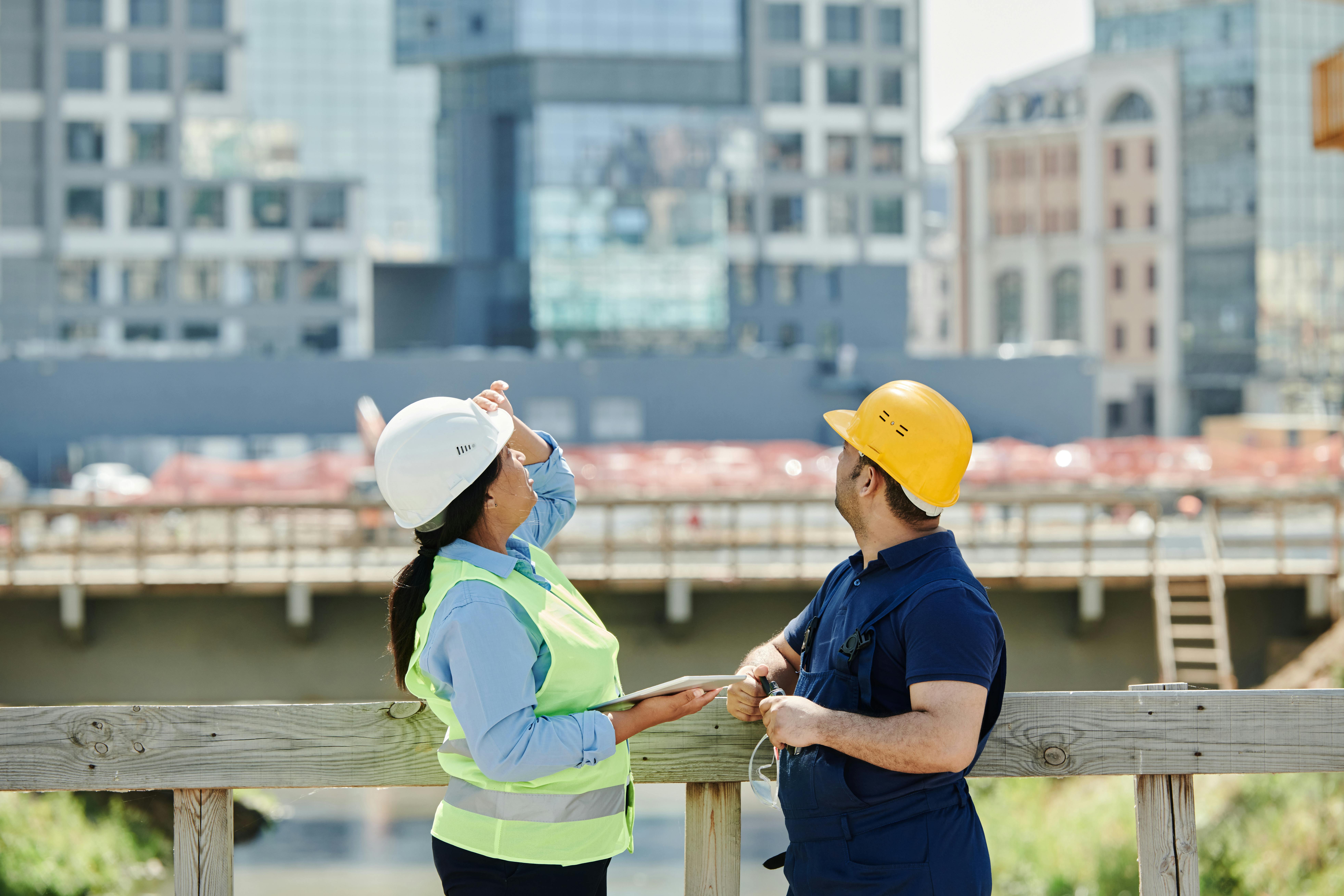 Construction professionals reviewing a live building site
